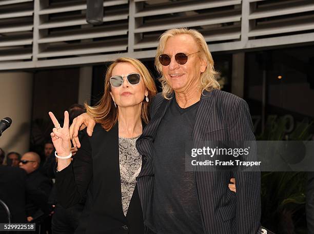 Recording artist Joe Walsh and wife arrive at the Ringo Starr 75th Birthday fan gathering held at Capitol Records in Hollywood.