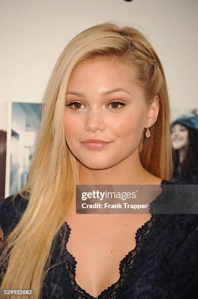 Actress Olivia Holt arrives at the premiere of "If I Stay" held at TCL Chinese Theater in Hollywood.