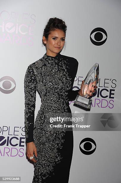 Actress Nina Dobrev, winner of the Favorite On Screen Chemistry award for "The Vampire Diaries,'" posing in the press room at The 40th Annual...