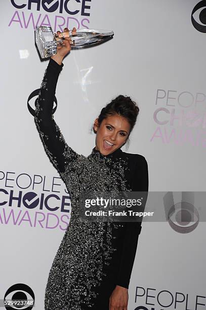 Actress Nina Dobrev, winner of the Favorite On Screen Chemistry award for "The Vampire Diaries,'" posing in the press room at The 40th Annual...