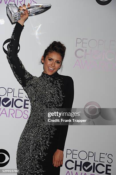 Actress Nina Dobrev, winner of the Favorite On Screen Chemistry award for "The Vampire Diaries,'" posing in the press room at The 40th Annual...