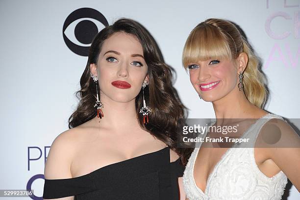Hosts Kat Dennings and Beth Behrs pose in the press room at The 40th Annual People's Choice Awards at Nokia Theatre L.A. Live.