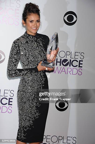 Actress Nina Dobrev, winner of the Favorite On Screen Chemistry award for "The Vampire Diaries,'" posing in the press room at The 40th Annual...