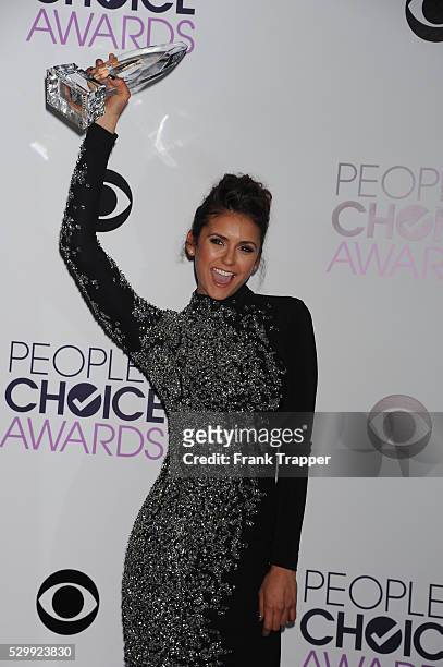 Actress Nina Dobrev, winner of the Favorite On Screen Chemistry award for "The Vampire Diaries,'" posing in the press room at The 40th Annual...
