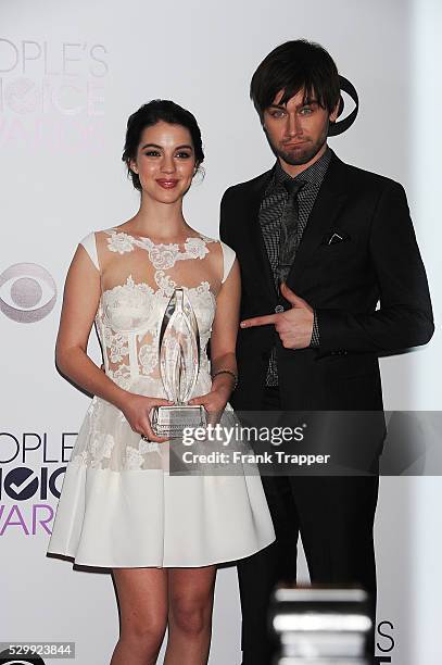 Actors Adelaide Kane and Torrance Coombs, winners of the Favorite New TV Drama award for "Reign", pose in the press room at The 40th Annual People's...