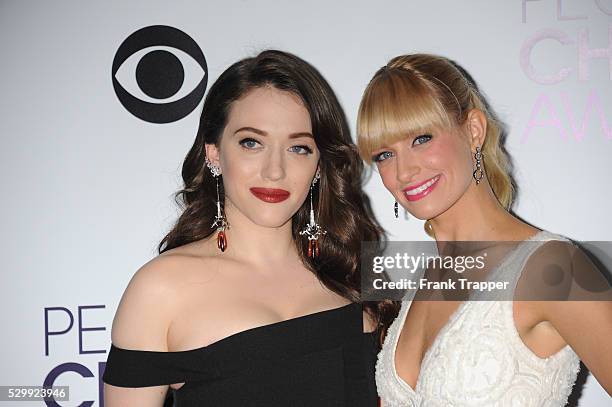 Hosts Kat Dennings and Beth Behrs pose in the press room at The 40th Annual People's Choice Awards at Nokia Theatre L.A. Live.