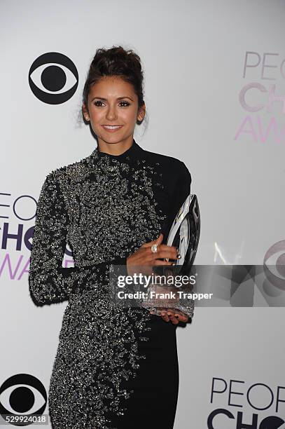 Actress Nina Dobrev, winner of the Favorite On Screen Chemistry award for "The Vampire Diaries,'" posing in the press room at The 40th Annual...