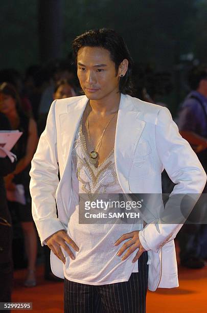 Hong Kong pop star Alex To poses for photo during the arrival of the 16th Golden Melody Award in Kaohsiung, southern Taiwan, 28 May 2005. Over 80...