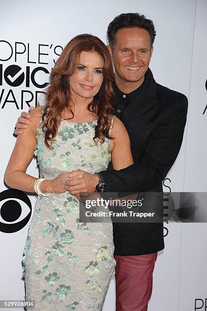 Actress Roma Downey and producer Mark Burnett arrive at The 40th Annual People's Choice Awards held at Nokia Theatre L.A. Live.