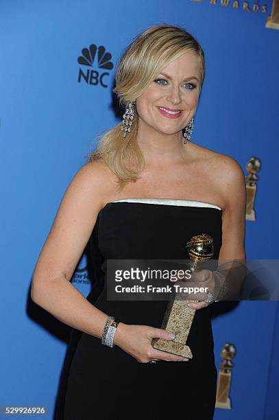 Actress Amy Poehler, winner of Best Actress in a Television Series - Musical or Comedy for "Parks and Recreation", posing at the 71st Annual Golden...