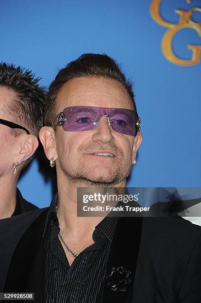 Musician Bono of U2, winner of Best Original Song for "Ordinary Love" from "Mandela: Long Walk to Freedom", posing at the 71st Annual Golden Globe...