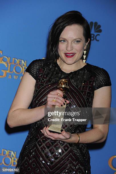 Actress Elisabeth Moss, winner of Best Performance in a Miniseries or Television Film for "Top of the Lake", posing at the 71st Annual Golden Globe...