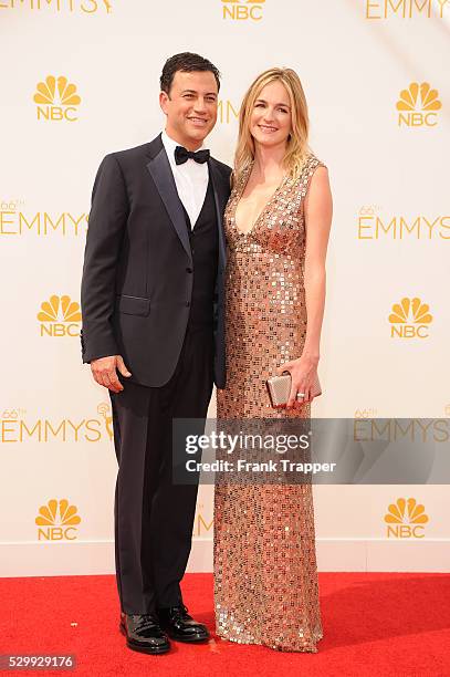 Host Jimmy Kimmel and guest arrive at the 66th Annual Primetime Emmy Awards held at the Nokia Theater L.A. Live.