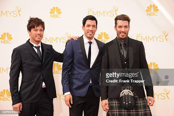 Personalities J. D. Scott, Drew Scott and Jonathan Silver Scott arrive at the 66th Annual Primetime Emmy Awards held at the Nokia Theater L.A. Live.