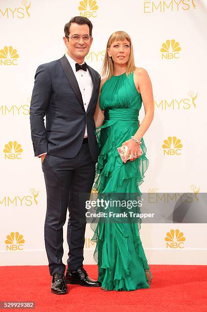 Actor Ty Burrell and Holly Anne Brown arrive at the 66th Annual Primetime Emmy Awards held at the Nokia Theater L.A. Live.