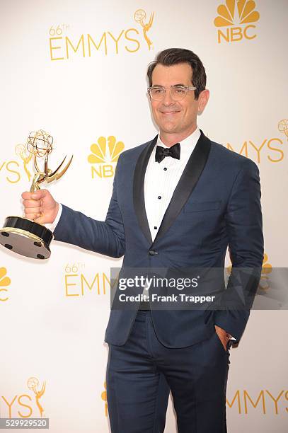 Actor Ty Burrell, winner of Outstanding Supporting Actor In A Comedy Series for "Modern Family" posing at the 66th Annual Primetime Emmy Awards held...