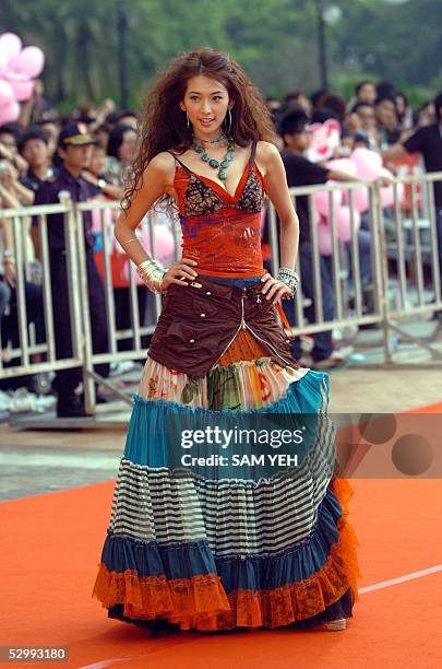 Taiwanese model Lin Chiling poses as she arrives at the 16th Golden Melody Award in Kaohsiung, southern Taiwan, 28 May 2005. Over 80 soloists or...