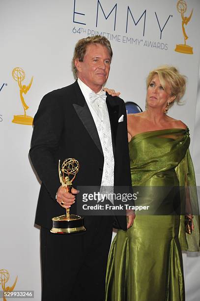 Actor Tom Berenger, winner Outstanding Supporting Actor in a Miniseries or a Movie for Hatfields & McCoys pose with his wife at the 64th Annual Emmy...