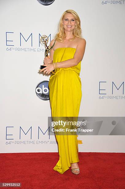 Actress Claire Danes posing with her Emmy for Outstanding Lead Actress in a Drama Series, Homeland at the 64th Annual Emmy Awards at the Nokia...