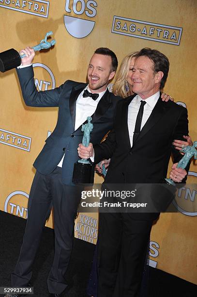 Actors Aaron Paul and Bryan Cranston, winner of the Best Ensemble in a Drama Series, pose at the 20th Annual Screen Actors Guild Awards held at The...