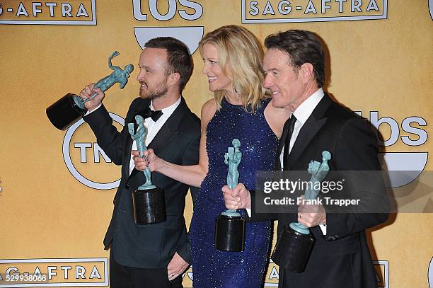 Aaron Paul, Anna Gunn and Bryan Cranston, members of the cast of "Breaking Bad", winner of the Best Ensemble in a Drama Series, pose pose at the 20th...