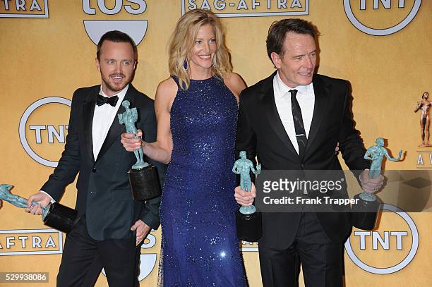 Aaron Paul, Anna Gunn and Bryan Cranston, members of the cast of "Breaking Bad", winner of the Best Ensemble in a Drama Series, pose pose at the 20th...