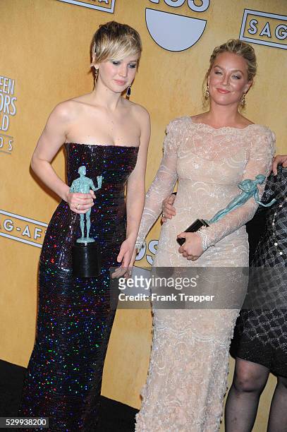 Actresses Jennifer Lawrence and Elisabeth Rohm, members of the cast of '"American Hustle", winner of the Best Cast in a Motion Picture award, pose at...