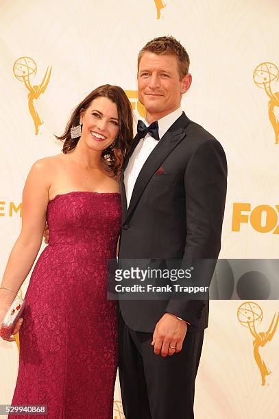 Actor Philip Winchester and wife Megan Marie Coughlin arrive at the 67th Annual Primetime Emmy Awards held at the Microsoft Theater.