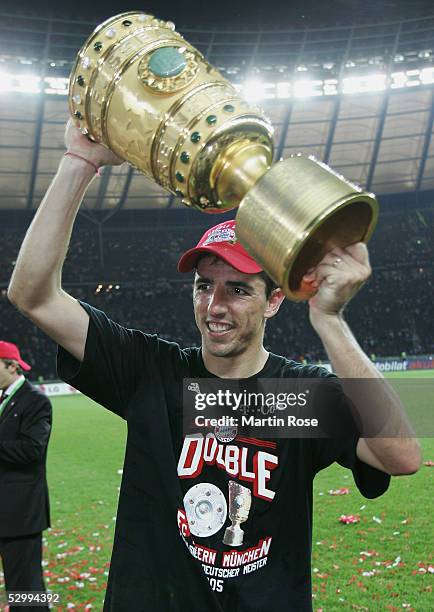 Roy Makaay of Bayern holds the trophy after winning the German Football Federations Cup Final between FC Schalke 04 and Bayern Munich on May 28, 2005...