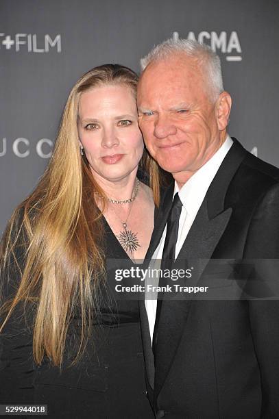 Actor Mlcolm McDowell and guest Kelley Kuhr arrive at LACMA 2012 Art + Film Gala held at LACMA.