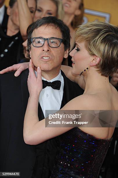 Actress Jennifer Lawrence and director David O. Russell arrive at the 20th Annual Screen Actors Guild Awards held at The Shrine Auditorium.