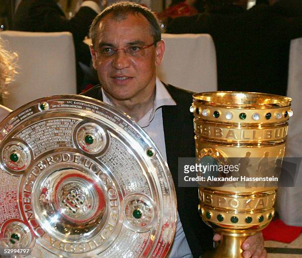 Munich's head coach Felix Magath presents the German Championship Trophy and the German Cup Trophy during the Bayern Munich champions party after the...