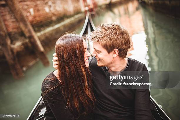 couple of tourist on the gondola in venice - venice with couple stock pictures, royalty-free photos & images