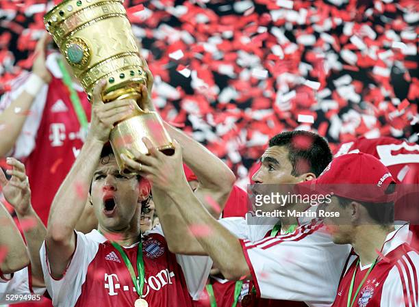 Michael Ballack and Lucio of Bayern presents the trophy after winning the German Football Federations Cup Final between FC Schalke 04 and Bayern...