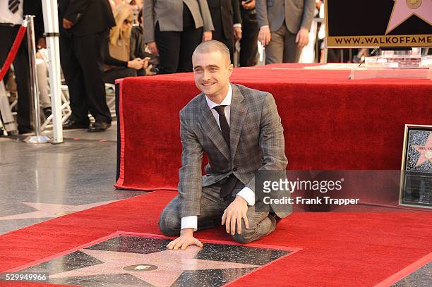 Actor Daniel Radcliffe posing at the ceremony that honored him with a Star on the Hollywood Walk of Fame.
