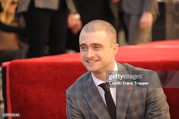 Actor Daniel Radcliffe posing at the ceremony that honored him with a Star on the Hollywood Walk of Fame.