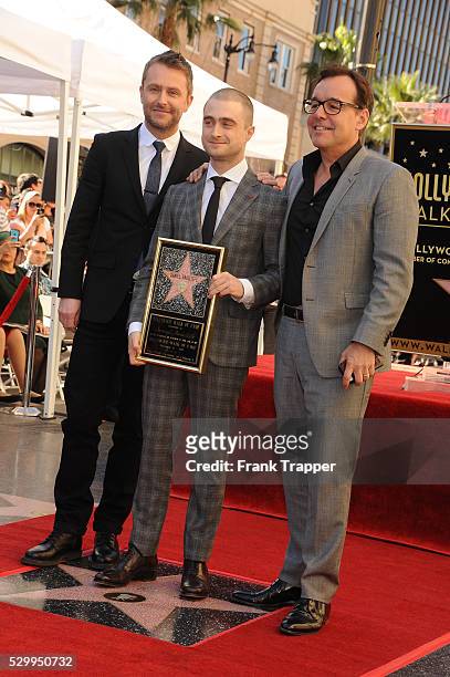 Actors Chris Hardwick, Daniel Radcliffe and director Chris Columbus pose at the ceremony that honored Daniel Radcliffe with a Star on the Hollywood...
