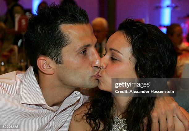 Soccerstar Hasan Salihamidzic of Munich and girlfriend Esther Copado kiss during the Bayern Munich champions party after the German Football...