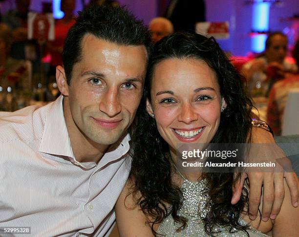 Soccerstar Hasan Salihamidzic of Munich and girlfriend Esther Copado pose during the Bayern Munich champions party after the German Football...