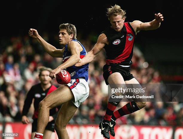 Ryan Hargrave for the Bulldogs spoils Mark Johnson for the Bombers during the AFL Round 10 match between the Essendon Bombers and the Western...