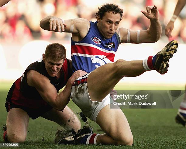 Jason Johnson for the Bombers tackles Mitch Hahn for the Bulldogs during the AFL Round 10 match between the Essendon Bombers and the Western Bulldogs...