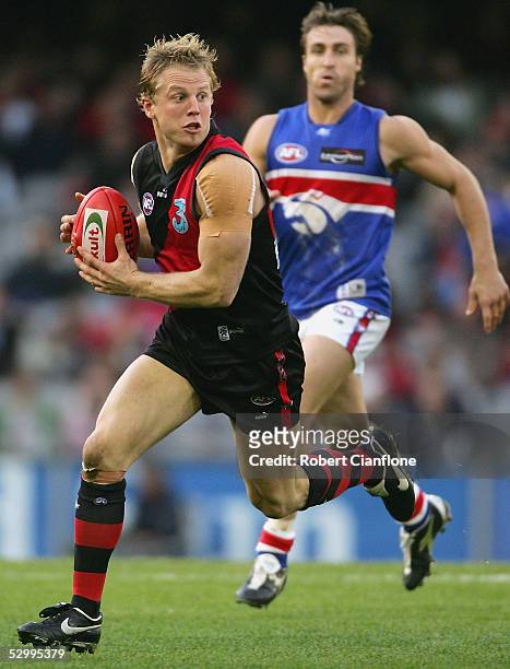 Mark Johnson of the Bombers in action during the round 10 AFL match between the Essendon Bombers and the Western Bulldogs at the Telstra Dome on May...