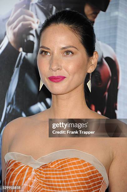 Actress Olivia Munn arrives at the premiere of "Robocop" held at TCL Chinese Theater in Hollywood.