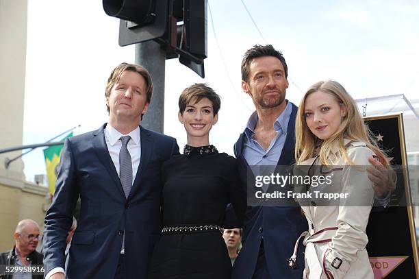 Director Tom Hooper, actors Anne Hathaway, Hugh Jackman and Amanda Seyfried pose at the ceremony that honored him with a Star on the Hollywood Walk...