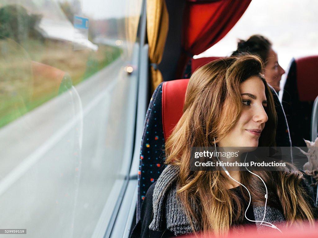 Young Woman Travelling With Bus