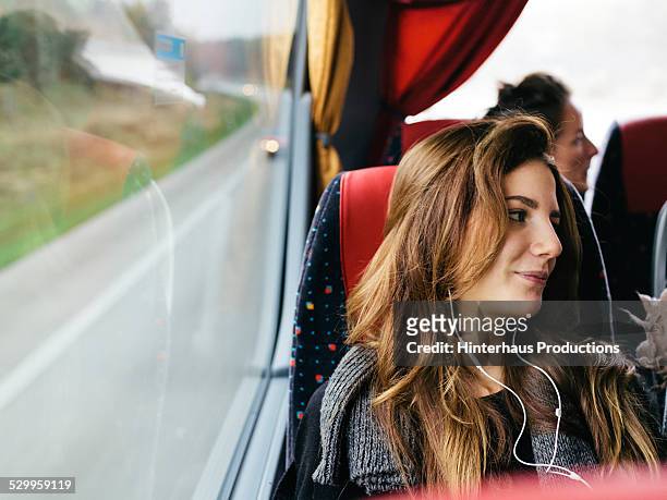 young woman travelling with bus - autobus foto e immagini stock