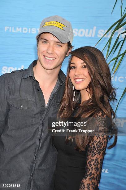 Actor Jeremy Sumpter and guest Genavive Helm arrive at the premiere of "Soul Surfer" held at Arclight Cinerama Dome in Hollywood.
