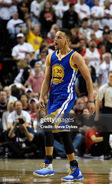 Stephen Curry of the Golden State Warriors celebrates after hitting a shot during overtime of Game Four of the Western Conference Semifinals against...