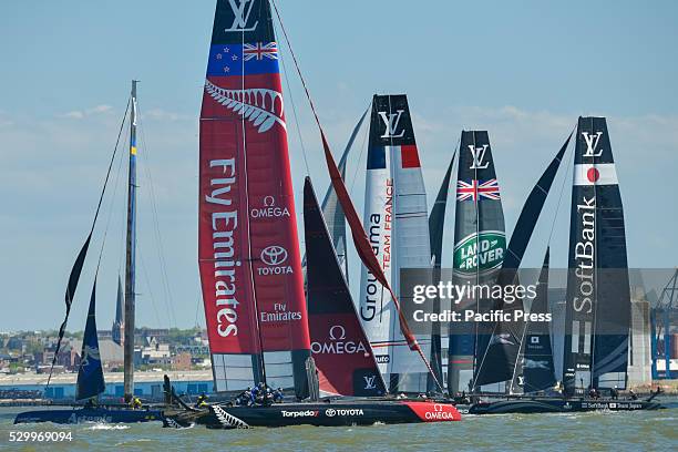 Emirates Team New Zealand takes the lead as the boats pass the first marker during the third race. Six competitors for the Louis Vuitton America's...