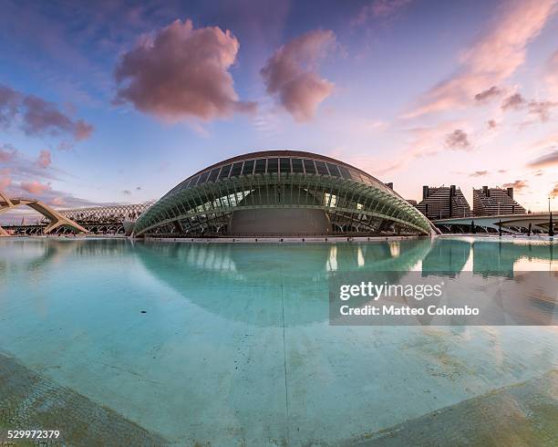 l'hemisferic reflected in water at sunset valencia - lhemisferic stock pictures, royalty-free photos & images